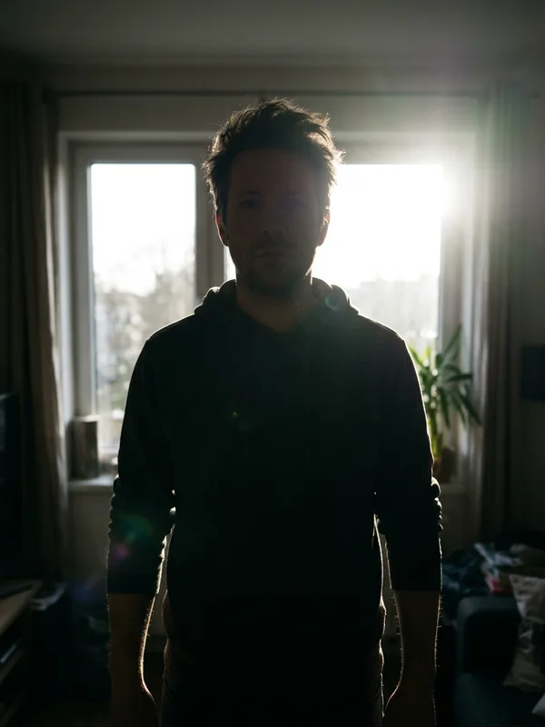 Bad example: man standing in front of a bright window with a dark face